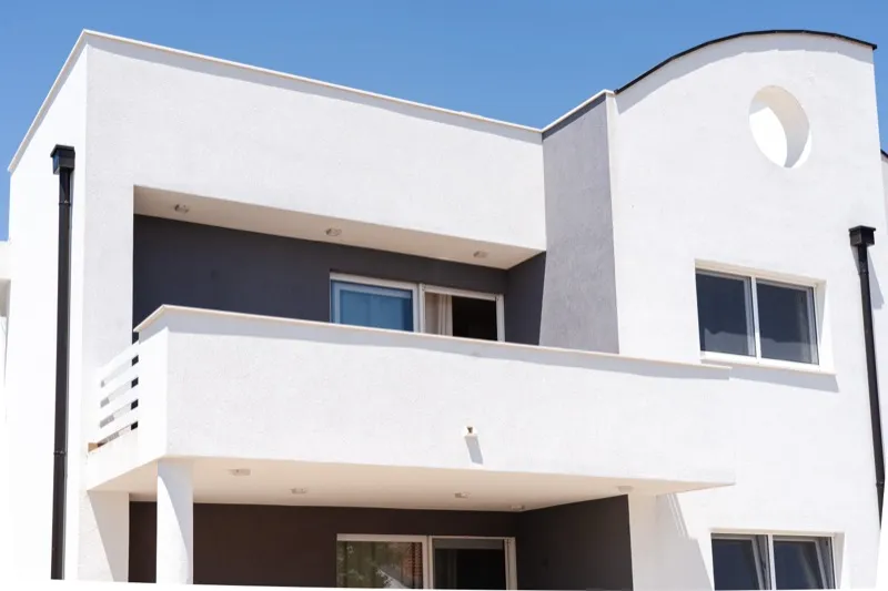 The house from outside, with the apartment terrace on the upper floor